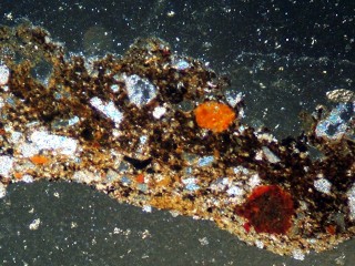 Archaeological soil aggregate observed in a micromorphological thin section under polarized light.